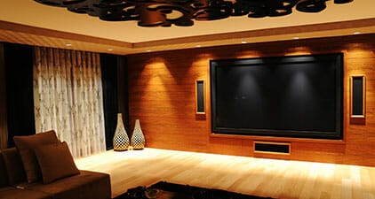 large screen on a wall to show custom lighting options for home theater