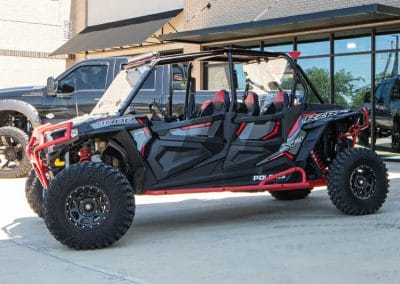 black and red polaris rzr outside