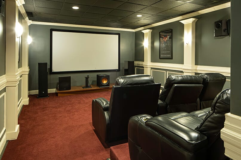 screen installed on a wall as part of a custom home theater